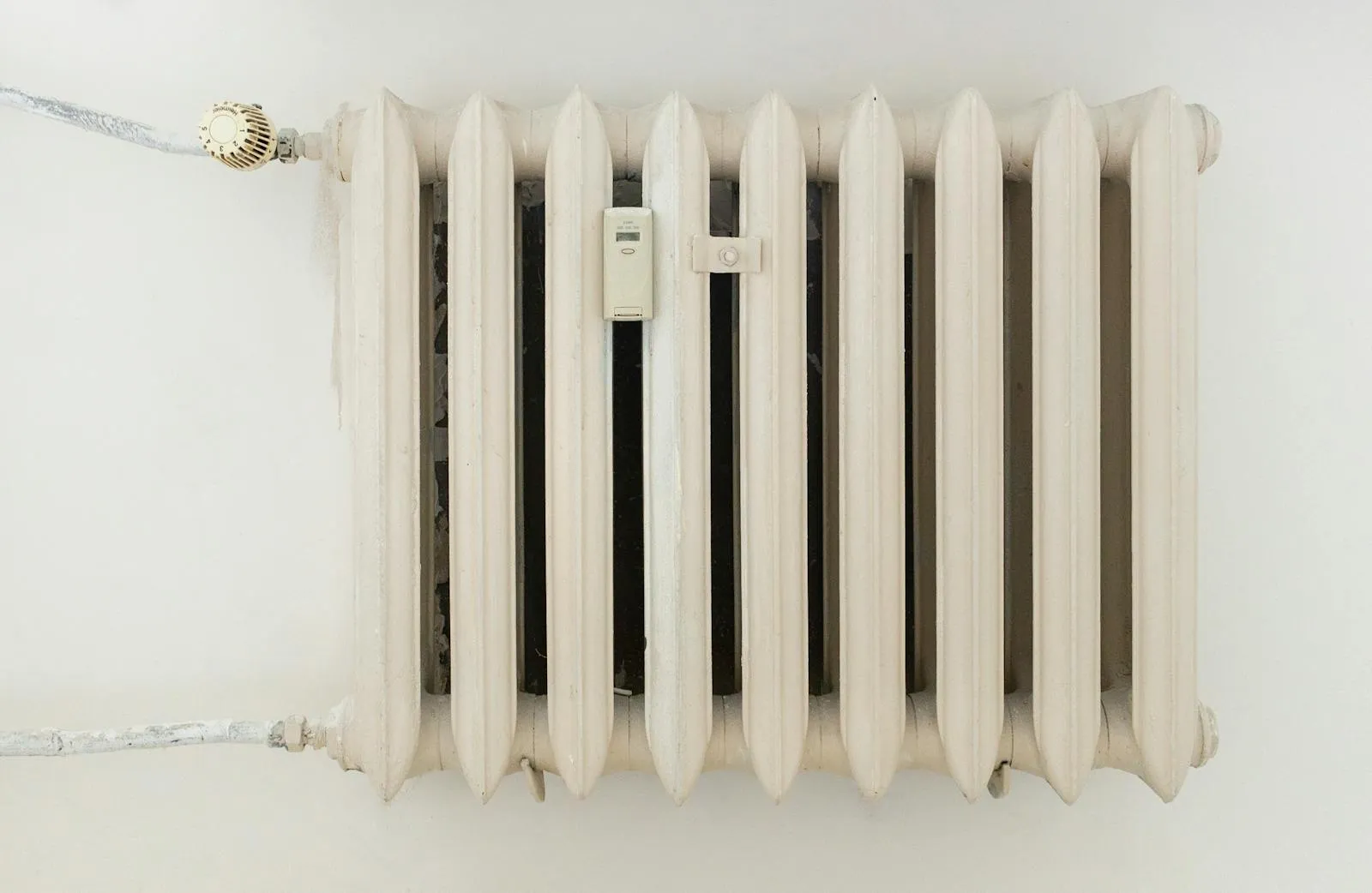 A column radiator in a Cambridge home — at heat pump temperatures, radiators are sized room by room against heat loss.